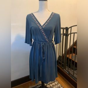 Alya form fitting, faux wrap dress. Size L